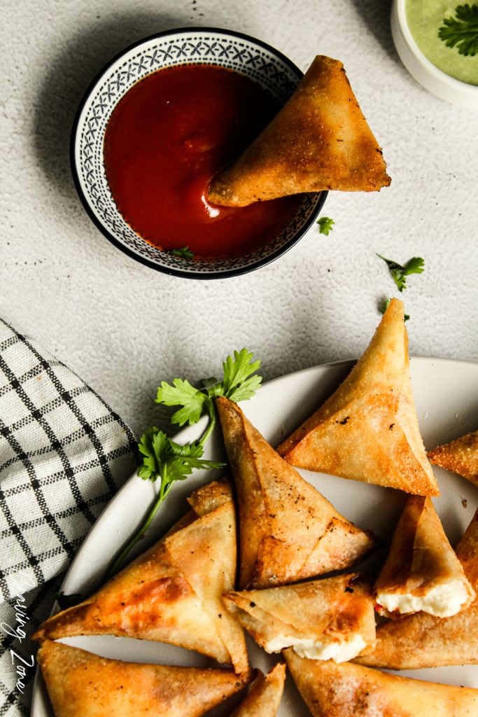 cheese samosa dipped in ketchup